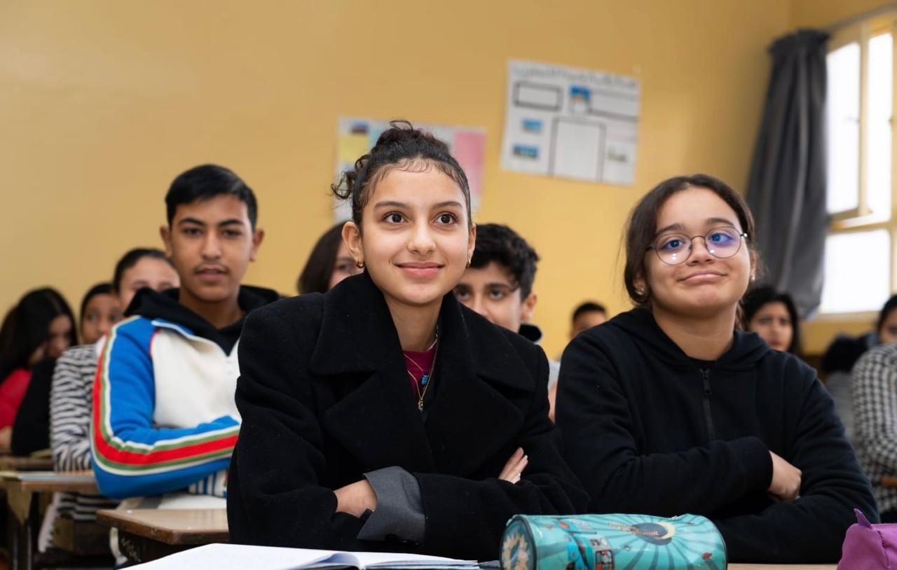 students smiling in class